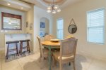 Gorgeous dining area with wet bar seating for nine